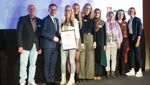 a group of people and Falko Mohrs at the awards ceremony