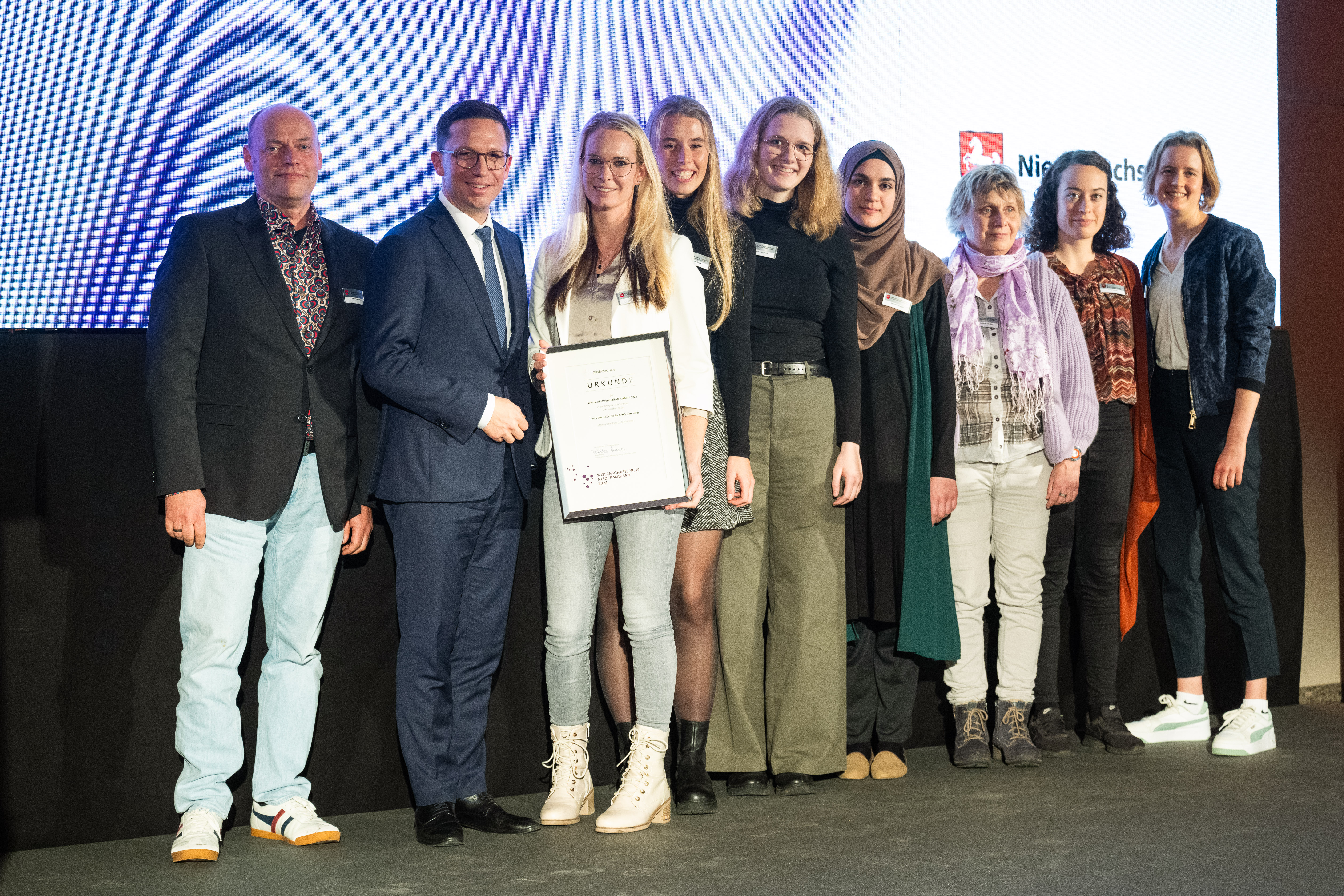 a group of people and Falko Mohrs at the awards ceremony